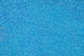 Top view of blue swimming pool and water splash.