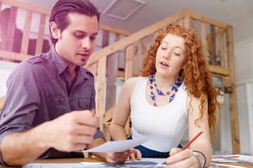 Obraz premium Two young architects in office