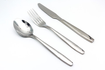 Cutlery set with Fork, Knife and Spoon isolated on white background with copy space for text.