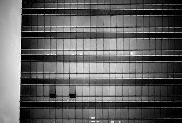 windows of business building with B&W color