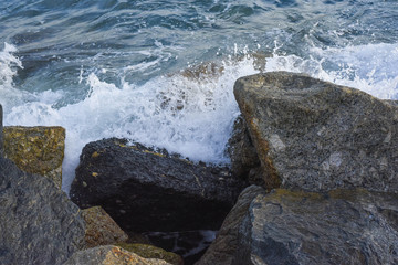 waves breaking on the shore with sea foam