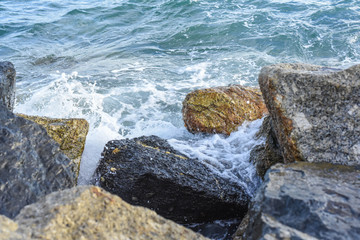 waves breaking on the shore with sea foam