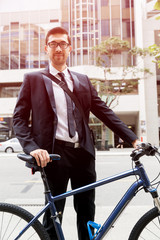 Young businessmen with a bike