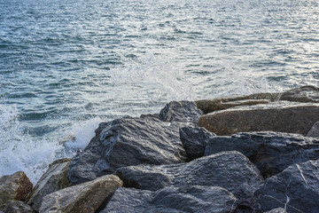 waves breaking on the shore with sea foam