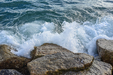 waves breaking on the shore with sea foam