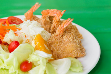 fried breaded prawn Milanese with Salad