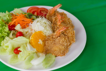fried breaded prawn Milanese with Salad