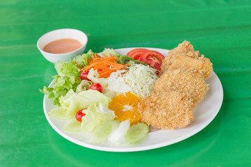 fried breaded chicken Milanese with Salad