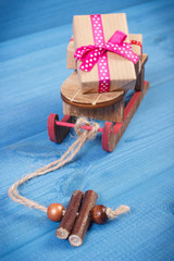 Wooden sled and wrapped gifts for Christmas or other celebration