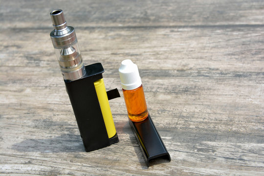 Electronic cigarettes and bottles of liquid.