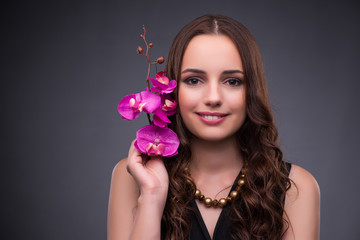Fototapeta premium Beautiful woman applying make-up in fashion concept 