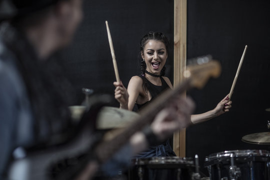 Female Rock Drummer At Recording Studio