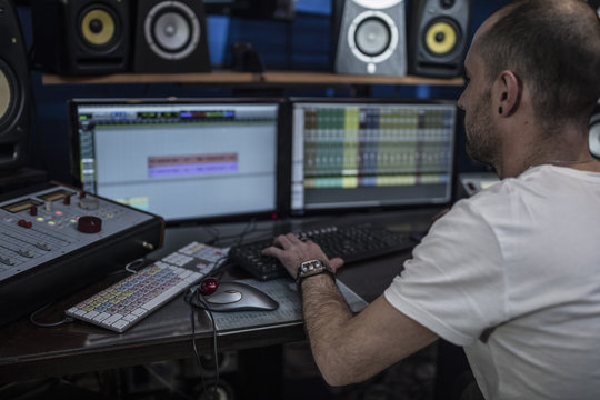 Audio engineer working in recording studio