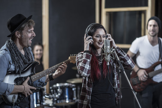 Rock band session in recording studio