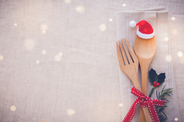 Christmas table place setting, holidays copy space fairy light toning background