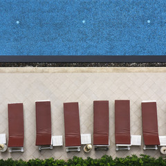 swimming pool with long chairs set on top view and square shape