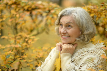 senior woman in  autumn park