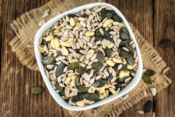 Mixed Seeds on wooden background (selective focus)