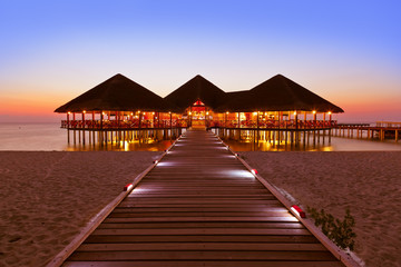 Water cafe at sunset - Maldives