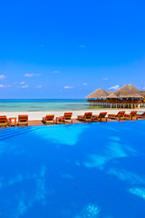 Fototapeta na wymiar Pool and cafe on Maldives beach