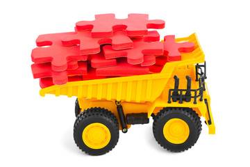 Obraz premium Toy truck with puzzle
