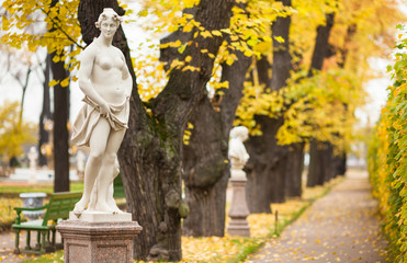 Euterpe - muse of lyric poetry and music. Autumn alley in park Summer Garden in St. Petersburg