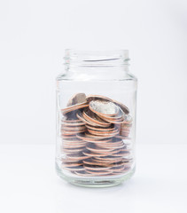 coins in glass bottle