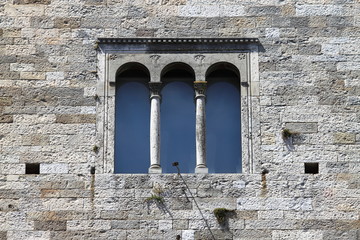 Medieval window in Todi. Umbria, Italy