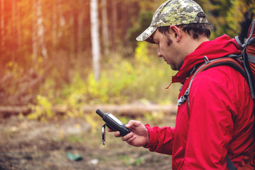 tourist looking at the navigator in his hand