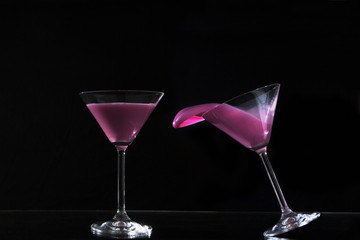 glasses of colored water / pair of cocktail glasses with colored water
