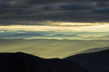 Rolling hills and mountains at autumn sunset, view from Bobija mountain, west Serbia