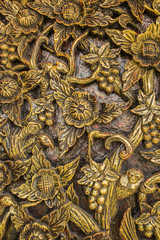 Pattern of flower carved on wood background. hand made in asia