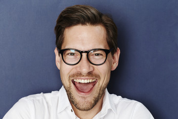 Excited guy in spectacles, portrait