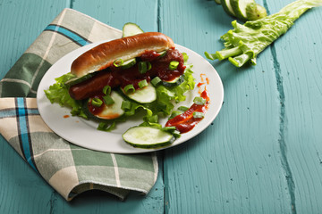 Hotdog with lettuce and cucumber