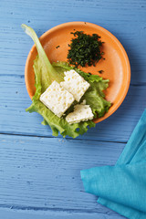 Small plate of cheese above view