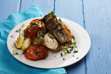 Chicken and baked vegetables closeup