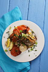 Chicken and baked vegetables above view