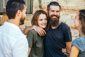 smilling couple with friends