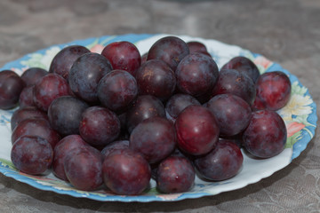 Plums on a plate.