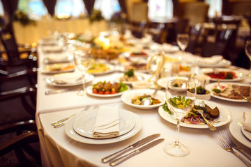 Table set for an event party or wedding reception. 

