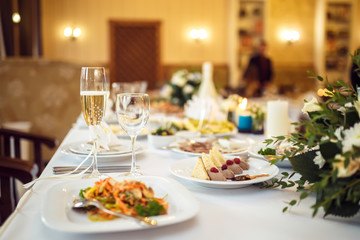 a glass of champagne at the wedding table