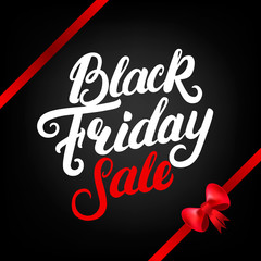 Black Friday Sale hand written lettering with red ribbon and bow.