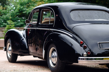 Fototapeta na wymiar Beautiful retro car. Elegance and style of first part of XX cen