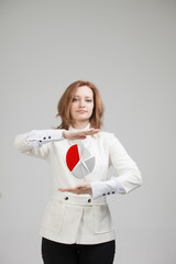 Woman shows a pie chart, circle diagram. Business analytics concept.