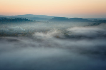 autumnal foggy sunrise
