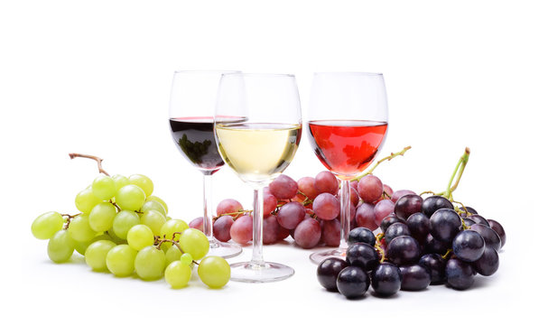 Red, rosé and white wine, with bunches of grapes