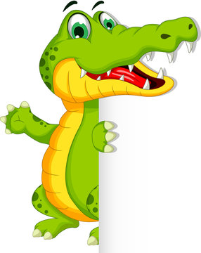 funny crocodile cartoon posing with blank sign