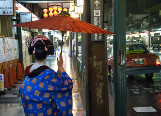 Japan, Kyoto - Portrait of traditional Japanese woman. Gion District at night.