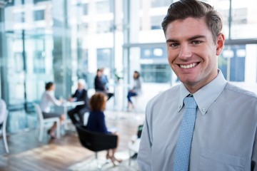 Smiling businessman in office