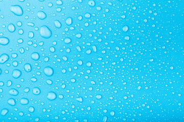 Naklejka na ściany i meble Drops of water on a color background. Toned
